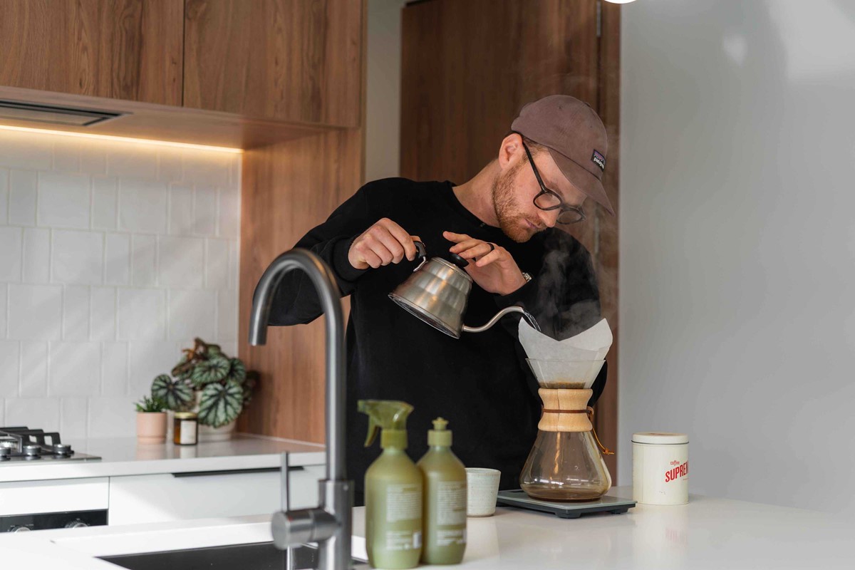 An ode to the Greater Wellington Region, Dan, in his kitchen producing a Supreme coffee for us from his favourite new toy, the Chemex. In the background, one of Suhanya's favourite features of the kitchen, the crisp tiled splashback.